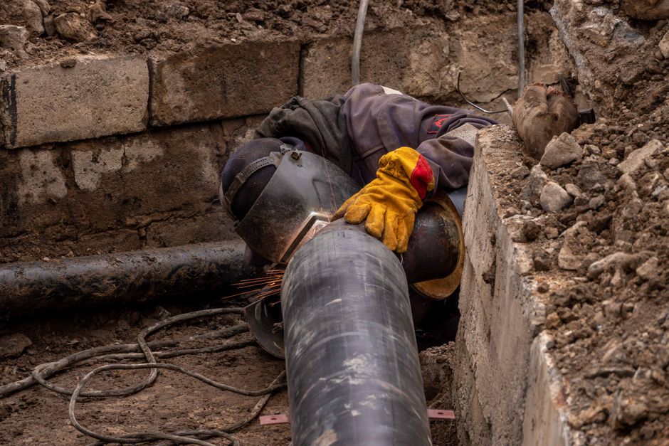 Close-up of drainage pipe repair work in Bromley garden